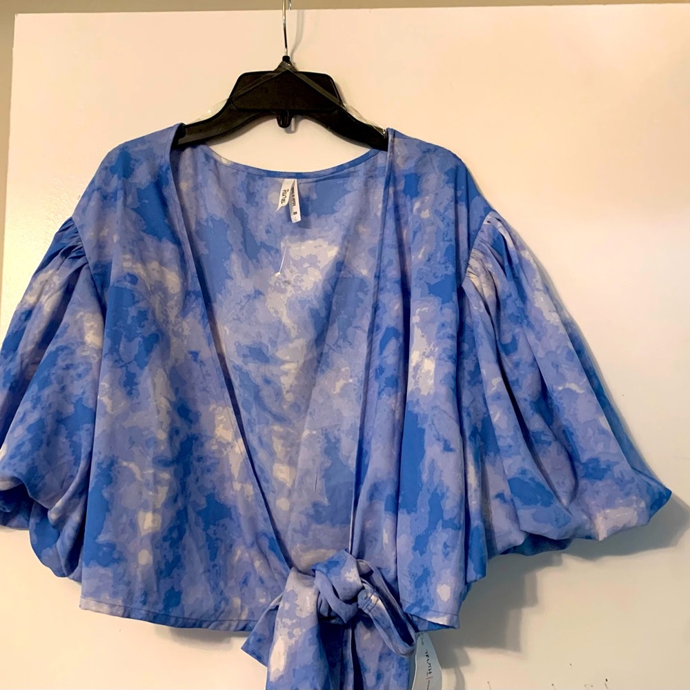 Two Piece Set. Top is crop top fit and bottoms are high waist fit.